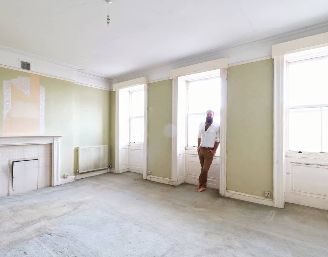 man with a hammer and cast iron radiator, photo by @manwithahammer